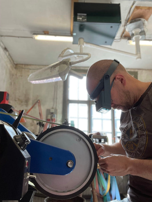 What is the best way to practice freehand grinding?